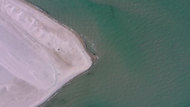 Aerial view directly above the Grenen - a meeting point of North and Baltic Sea (Skagerrak and Kattegat) on Skagen Odde peninsula. North Jutland, Nordjylland, Denmark