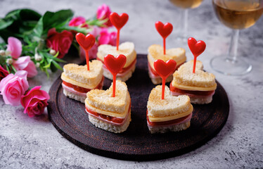 Sausage tomato cheese canapes in the form of heart for Valentine's day holiday