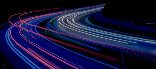 Fotobehang Snelweg bij nacht Night road lights. Lights of moving cars at night. long exposure