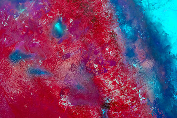 ..Bright red and blue abstract colorful background texture. Multi-colored paints.