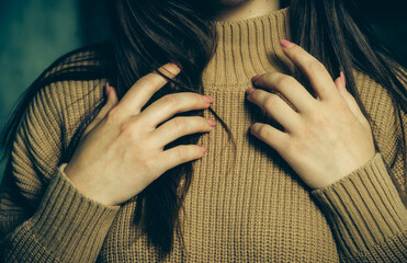 female hands and sweater close-up