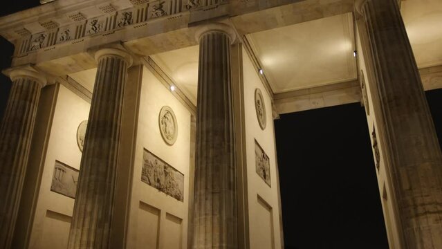 Illuminated Arch, Architectural Splendor, Berlin Twilight. Post-dusk, Brandenburg Gate emerges in splendid display of lights.