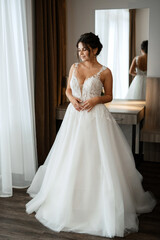 Fototapeta premium bride in a white dress at the training camp