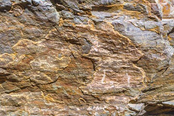 Texture of granite stone. Natural mountain stone. Rusty texture shades