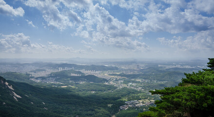 Fototapeta na wymiar Seoul City visible from Bukhansan National Park which is located just outside of Seoul.