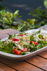 Summer Strawberry, cucumber salad with lettuce, feta cheese and almonds. Healthy Food.