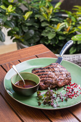 grilled beef steak with spices on a knife Food on plate. Restaurant menu concept. Copy space.
