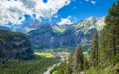 Fototapeta na wymiar Alpine mountain and village view in Kandersteg, Switzerland, sunny landscape
