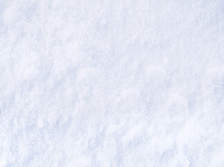 Background of fresh snow. Snowy white texture. Snowflakes.
