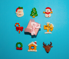 Christmas ornaments on pastel blue background. Flat lay. New Year concept.