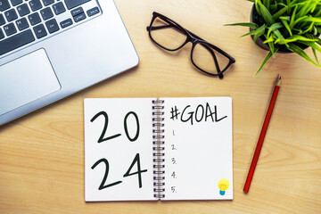 2024 Happy New Year Resolution Goal List and Plans Setting - Business office desk with notebook...