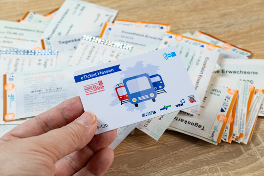 female hand holds electronic eTicket Germany, plastic monthly travel card, Digital Transformation in Transit, Public Transportation Technology, Frankfurt - December 3, 2023