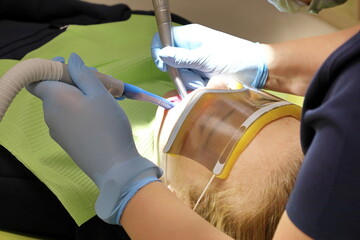 equipment for a modern dental office, invisible overlays on teeth of a young girl