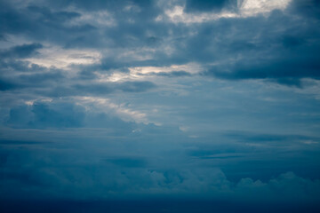 Stormy heavy mystical sky with dark rainy gloomy dramatic clouds surrounded by cinematic atmosphere
