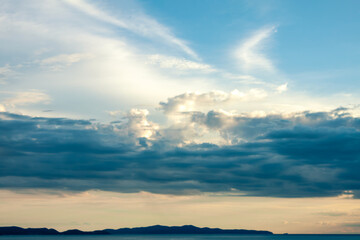 Beautiful cloudscape with romantic fluffy contrast clouds on the clear gradient sky with cinematic atmosphere on the horizon
