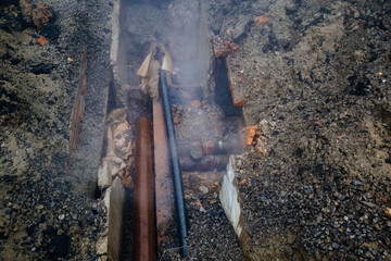 Leak of water in broken old rusty pipes of the heating system