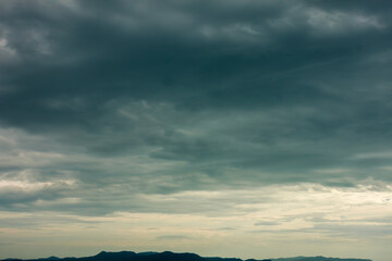Dramatic moody sky after the storm with heavy clouds on the horizon 