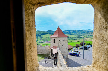 Famous castle ruins of Rupea Citadel, Cetatea Rupea, ruins of a castle in summer with a blue sky,...