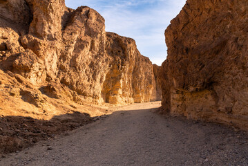 Sunset in the canyon with a blue sky on the background
