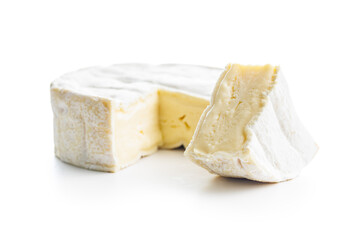 Brie type cheese with white mold. French camembert cheese isolated on white background.