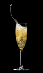 Glass of champagne isolated on a black background