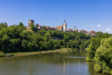Fototapeta premium Bad Wimpfen with a view of the old church and the historic city wall over the Neckar river