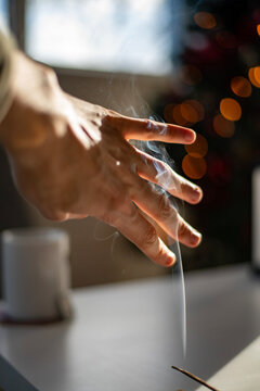 person with incense stick
