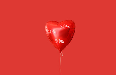 Heart-shaped balloon on red background. Valentine's Day sale