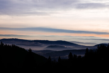 Soft fog in the mountains during sunset