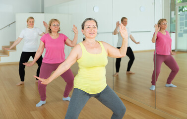 Aged European women are dancing during a fitness training session