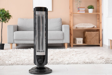 Electric heater in stylish living room. Concept of heating season