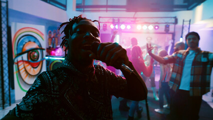 POV of dancer recording vlog at club, having fun with friends on dance floor at discotheque. Smiling person enjoying night out filming video of people dancing, clubbing. Handheld shot. - obrazy, fototapety, plakaty