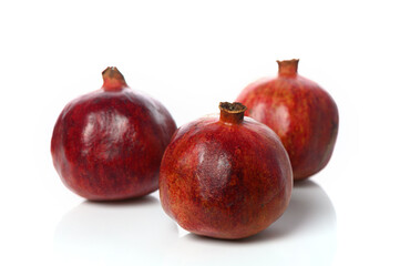 three pomegranates on a white background 1