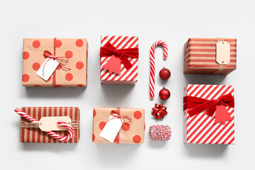 Obraz premium Composition with gift boxes and Christmas decorations on white background