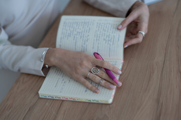 woman reading a notebook