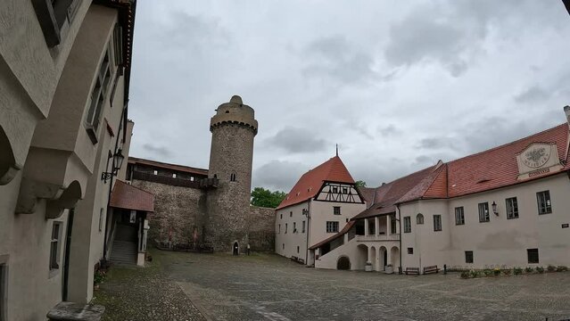 Strakonice castle Panoramic view with its medieval tower under fast-moving clouds in Bohemia, Czech Republic, captured in scenic timelapse.

