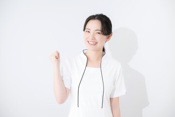 Young female nurse in white nurse's uniform, beauty, medical, etc., gut-punching, camera-ready, white background, upper body