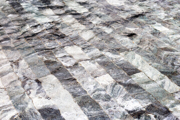 Water with dark grey floor tiles texture