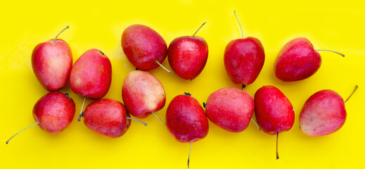 Fresh small red apples on white background