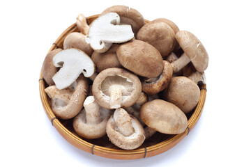 Fresh shiitake mushrooms on white background.