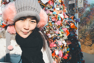 Asian women celebrate their love by wearing padlocks.
,Seoul Tower, South Korea, Valentine's Day