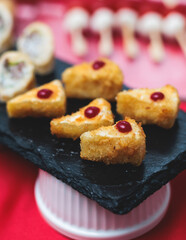 Catering table, beautifully decorated banquet with variety of with different food snacks appetizers on corporate birthday party event or wedding celebration, canape, salad, delicatessen setting