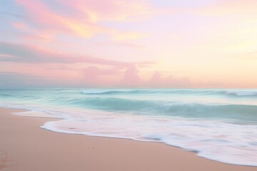 Serene beach at sunrise, with calm waves, soft sand, and a pastel-colored sky.