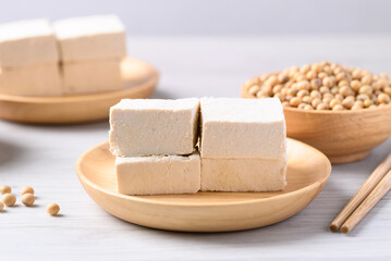 Fresh tofu in wooden bowl, Vegan food ingredient in Asian cuisine, Plant based diet