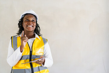 Senior professional African black female real estate foreman inspecting inside the building construction. - obrazy, fototapety, plakaty