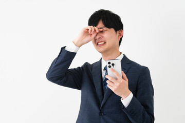 ビジネススーツを着ている若い男性　ビジネスイメージ