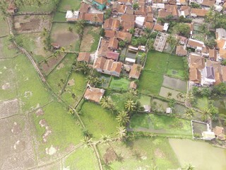 Drone Photography. Aerial Landscapes. Patchwork Landscape and Village in the Morning, Located in Rancaekek, Bandung - Indonesia. Aerial Shot from a flying drone.