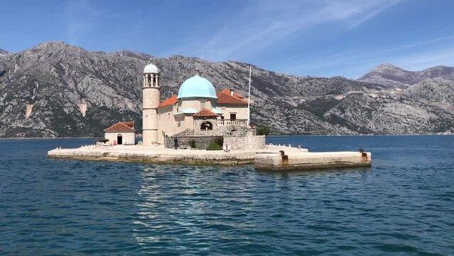 Our Lady of the rock. Artificial island in Montenegro.  Shooting from a moving boat on a clear weather day.