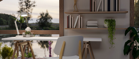 Interior design of a cosy Scandinavian cottage house with a desk near by the window with lake view.