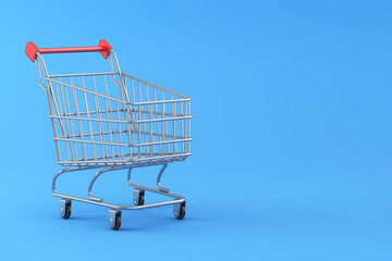 Empty Shopping cart on blue background